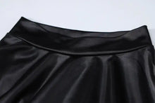 Load image into Gallery viewer, Close-up of faux leather fabric on a ruched mini dress, showcasing its sleek and sophisticated design.