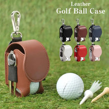 Cargar imagen en el visor de la galería, Leather golf ball pouch with snap closure, shown in various colors, next to a golf ball and tee on grass.