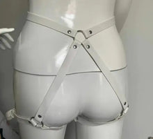 Cargar imagen en el visor de la galería, Back view of white PU leather garter belt harness on mannequin, showcasing stylish design and adjustable straps for seductive elegance.