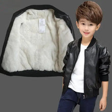 Cargar imagen en el visor de la galería, Boy wearing a vegan leather and fur jacket, showcasing interior fur lining against a gray background, perfect for winter fashion.