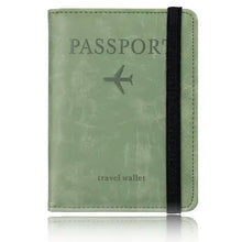 Cargar imagen en el visor de la galería, Green leather RFID-blocking passport holder travel wallet with black elastic band for security and style.
