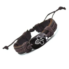 Cargar imagen en el visor de la galería, Thick leather bracelet with engraved stone bee motif, adjustable design for a bold fashion statement.