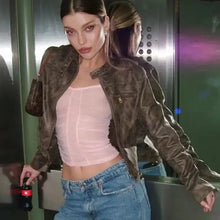 Charger l'image dans la galerie, Model wearing vintage zip-up faux leather jacket with jeans, standing confidently with edgy style