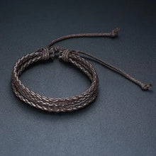 Cargar imagen en el visor de la galería, Braided wrap leather bracelet showcasing intricate craftsmanship and stylish design on a black background.