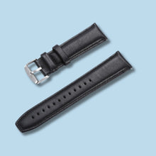 Load image into Gallery viewer, Premium black leather watch band on light blue background, showcasing elegant and durable design.