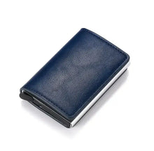 Cargar imagen en el visor de la galería, Hold anti-theft blue vegan leather wallet with RFID/NFC protection, showcasing a compact and sleek design. Imported.