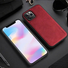 Load image into Gallery viewer, Luxury red leather iPhone case with hybrid protective design showcasing elegance and durability on a black background.