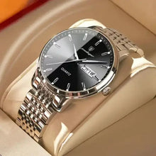 Load image into Gallery viewer, Men's stainless steel watch with sleek design on beige cushion.