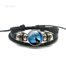 Cargar imagen en el visor de la galería, Handmade leather bracelet with wolf and full moon design, featuring braided bands and premium materials for a wild, stylish look.