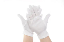Load image into Gallery viewer, Hands wearing soft cotton white gloves, providing comfort and protection for sensitive skin and delicate tasks.