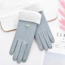 Load image into Gallery viewer, Winter thick plush gloves with soft white lining on a table, designed for warmth and comfort during cold seasons.
