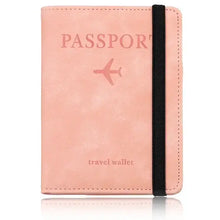 Cargar imagen en el visor de la galería, Pink leather passport holder with black elastic band featuring RFID blocking technology, stylish travel accessory.