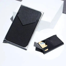 Cargar imagen en el visor de la galería, RFID Black Magic Trifold Vegan Leather Wallet with card compartments displayed on a white surface, sleek and compact design