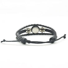 Cargar imagen en el visor de la galería, Handmade leather wolf bracelet featuring a wolf and full moon design, showcasing high-quality craftsmanship and style.