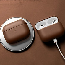 Cargar imagen en el visor de la galería, Genuine leather AirPods case in brown, featuring wireless charging and durable protection for AirPods.