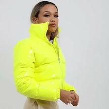 Cargar imagen en el visor de la galería, Woman wearing a shiny neon yellow PU leather winter jacket, showcasing a chic and glossy design, perfect for cold-weather fashion.