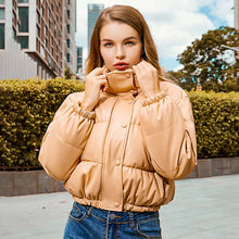 Load image into Gallery viewer, Woman wearing a stylish winter thick PU leather coat, perfect for cozy and fashionable cold-weather wear.