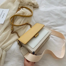 Cargar imagen en el visor de la galería, Stylish designer leather crossbody shopping bag with yellow accents, ideal for fashion-forward retail therapy.