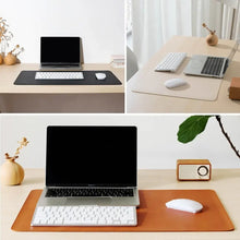 Cargar imagen en el visor de la galería, Elegant leather suede desk mat enhancing workspace with style and protection, featuring laptop, keyboard, and mouse on wooden desk.
