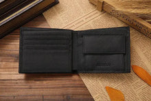 Cargar imagen en el visor de la galería, Open men's premium leather wallet on wooden surface with newspaper in background, showcasing card slots and coin pocket.