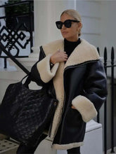 Load image into Gallery viewer, Woman wearing Cozy Chic Bomber Jacket, black vegan leather with faux wool, stylish winter outfit
