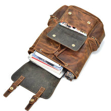 Charger l'image dans la galerie, The Hagen Backpack | Vintage Leather Backpack with open compartments showing books and gadgets, made of soft durable cowhide leather.