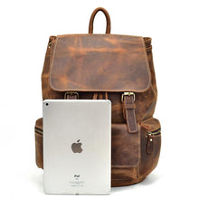 Charger l'image dans la galerie, The Hagen Backpack | Vintage Leather Backpack with tablet for size comparison, showcasing genuine cowhide leather and spacious design.