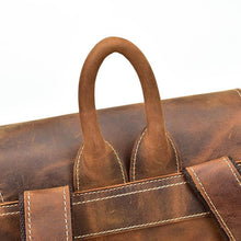 Charger l'image dans la galerie, Close-up of The Hagen Backpack | Vintage Leather Backpack handle in genuine cowhide leather with natural creases.
