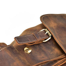 Charger l'image dans la galerie, Close-up of The Hagen Backpack | Vintage Leather Backpack with brass buckle and natural creases in the cowhide leather