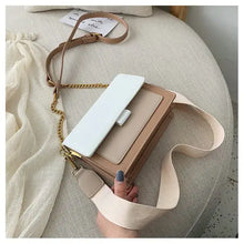 Cargar imagen en el visor de la galería, Stylish designer leather crossbody shopping bag with beige and white details, perfect for fashion-forward retail therapy.