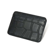 Cargar imagen en el visor de la galería, Black leather magic wallet with textured design for sleek organization and secure card and cash storage.