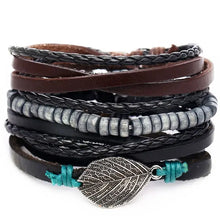 Charger l'image dans la galerie, Multilayer leather bracelet with braided strands, metal beads, and leaf charm, offering rugged elegance and style.
