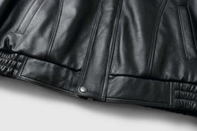 Load image into Gallery viewer, Close-up of REED Men's Bomber Genuine Leather Jacket showcasing sleek black leather texture and stylish design.