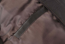 Load image into Gallery viewer, Close-up of REED Men's American Style Bomber Jacket inner lining and pocket, highlighting genuine leather craftsmanship.