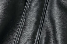Load image into Gallery viewer, Close-up of genuine leather texture on a REED men's American style bomber jacket.
