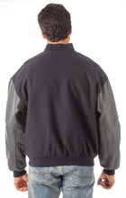 Cargar imagen en el visor de la galería, Model wearing REED Men's Premium Varsity Leather/Wool Jacket, USA-made, back view showcasing leather sleeves and classic design.