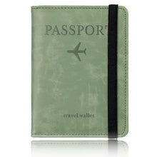 Cargar imagen en el visor de la galería, Green leather blocking passport holder with RFID protection and black elastic band.