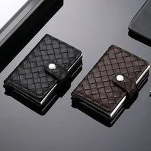 Load image into Gallery viewer, Black and brown leather RFID cardholders with secure clasp buttons on a sleek surface, designed for card safety and elegant style.