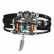 Charger l'image dans la galerie, Multilayer leather bracelet with silver and turquoise accents and feather charm, enhancing style and elegance.
