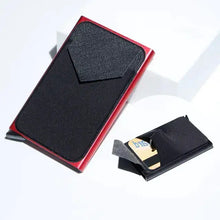 Cargar imagen en el visor de la galería, RFID black trifold leather slim mini wallet on a white surface showcasing sleek design and modern functionality.