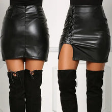 Load image into Gallery viewer, Vegan leather high-slit skirt with lace-up front design, black color, paired with knee-high boots, showcasing edgy and chic style.