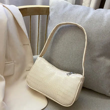 Load image into Gallery viewer, Crocodile pattern PU leather women's shoulder bag on a chair, stylish and perfect for all occasions, featuring convenient zipper.