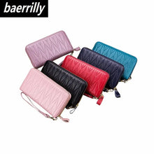 Cargar imagen en el visor de la galería, Assorted colors of leather female travel purses, designed for organization and style, featuring durable zippers and wrist straps.