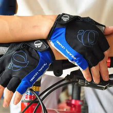 Cargar imagen en el visor de la galería, Cyclist wearing high-grip blue and black cycling gloves for protection and control.