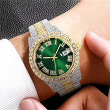 Cargar imagen en el visor de la galería, Luxurious Diamond Roman Wrist Watch with gold stainless steel and green dial, showcasing opulent diamond-encrusted bezel on wrist.
