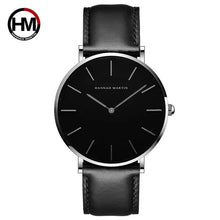 Cargar imagen en el visor de la galería, Sleek black dial leather strap watch with minimalist design.