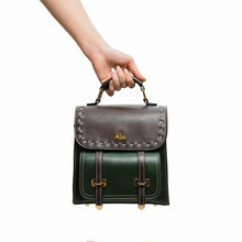 Load image into Gallery viewer, Hand holding Bumblebee vegan leather backpack in green and brown, featuring sleek design, perfect for professional style and organization.