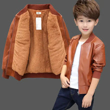 Cargar imagen en el visor de la galería, Boy wearing a stylish brown vegan leather and fur jacket, showing warmth and sophistication, perfect for an upgraded winter wardrobe.