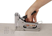 Charger l'image dans la galerie, eZthings 3-in-1 staple gun in use on wood with 2400 staples, ideal for carpentry, upholstery, and more heavy-duty projects.