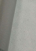 Cargar imagen en el visor de la galería, Close-up of a rolled leather hide, showcasing the texture and quality of cow skin, ideal for crafts and soft garments.